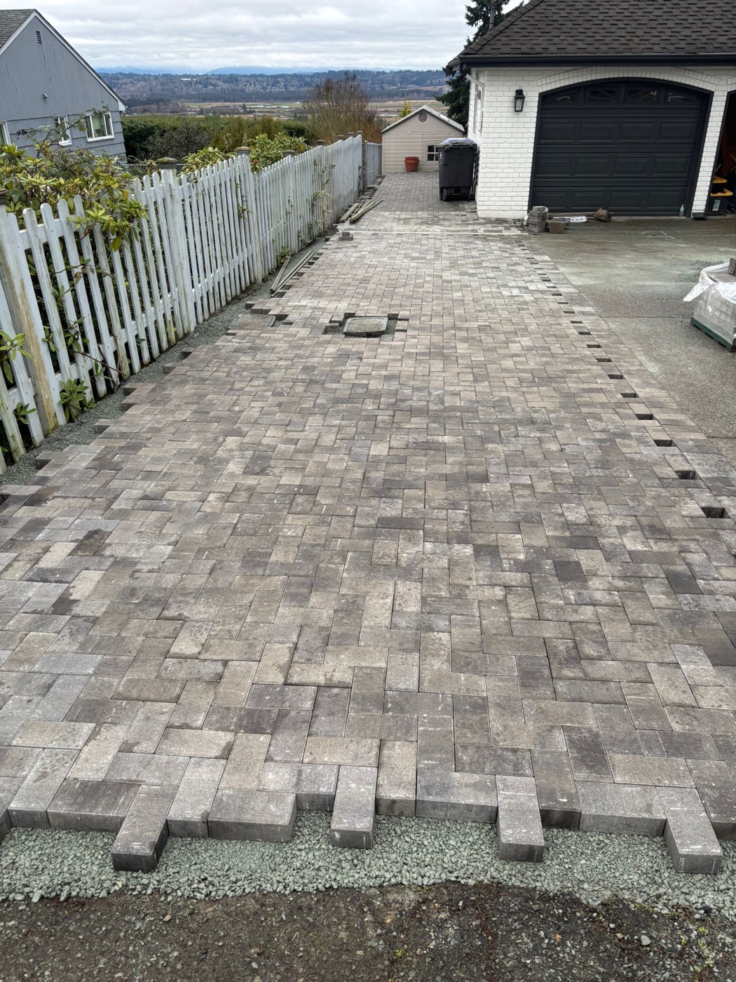 Paver area during installation near driveway